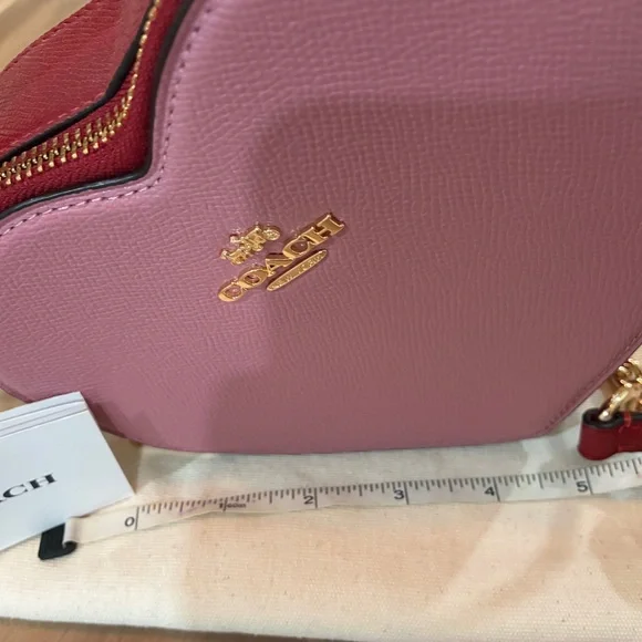 Coach Pink Heart-Shaped Crossbody Bag with Gold Accents. Beautiful timeless shap - Picture 2 of 6